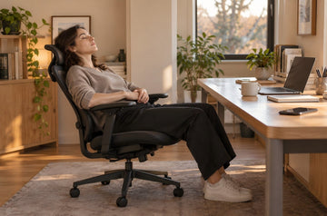 Office worker napping in an ergonomic chair