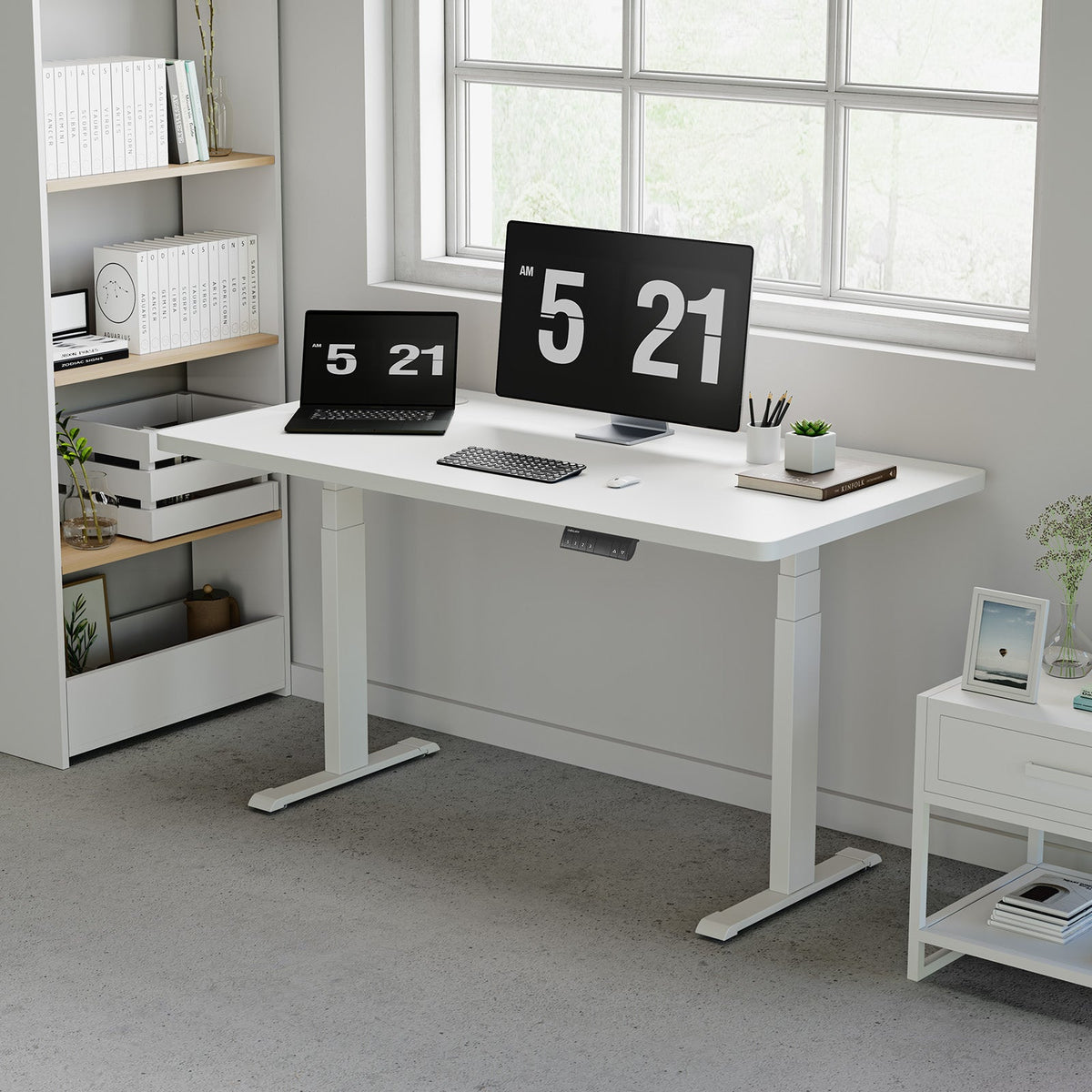 White OdinLake S450 standing desk with a laptop, monitor, keyboard, mouse, and visible control keypad