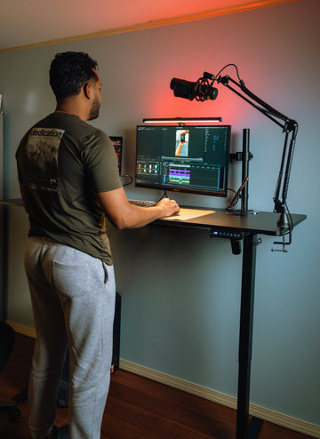 OdinLake workstation with a monitor mounted on an adjustable arm above a standing desk