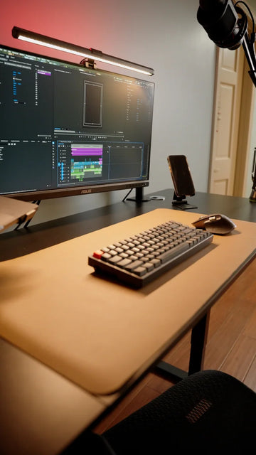 OdinLake standing desk with a clear desktop, monitor, keyboard, and desk mat
