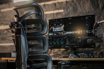Rear three-quarter view of an OdinLake O2 chair at a media workstation